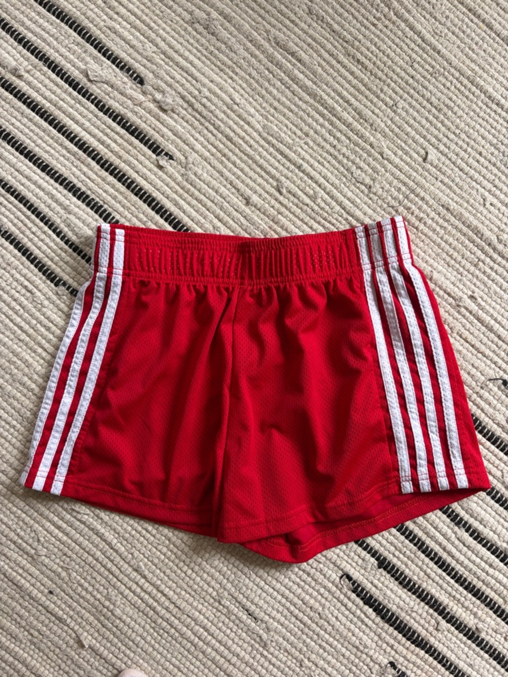 Red Athletic Shorts with White Side Stripes